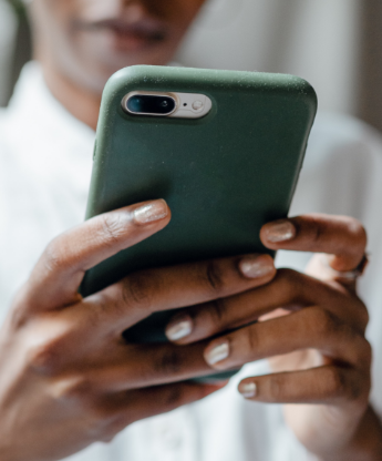 person looking at smartphone in hand