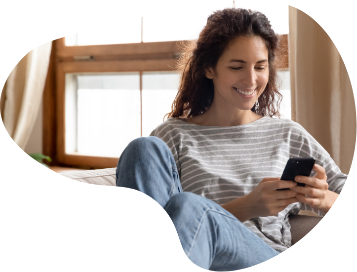happy woman looking at her phone
